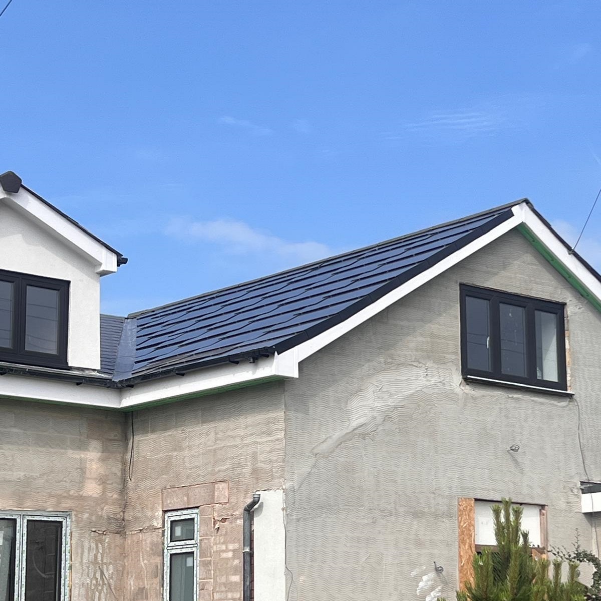 solar roof tiles on house