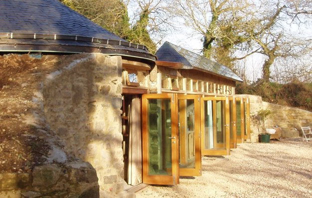 brittany groundhouse earthship with solar thermal slates